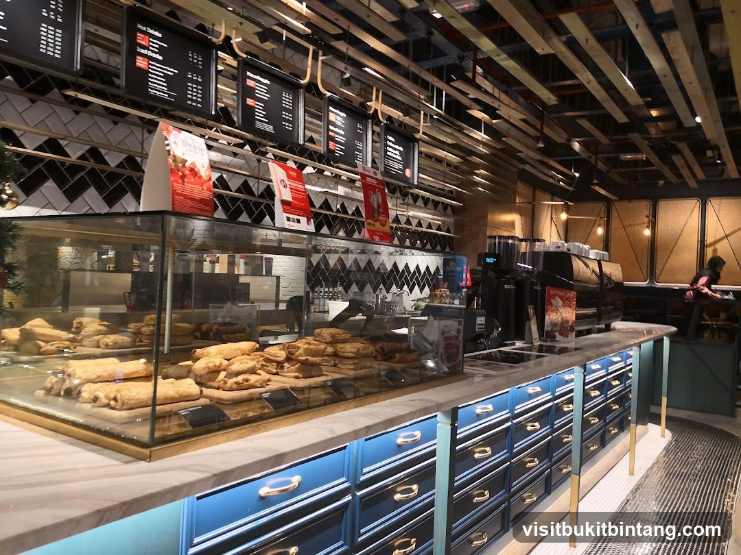 Cafe Interior with Pastries and Coffee Machines