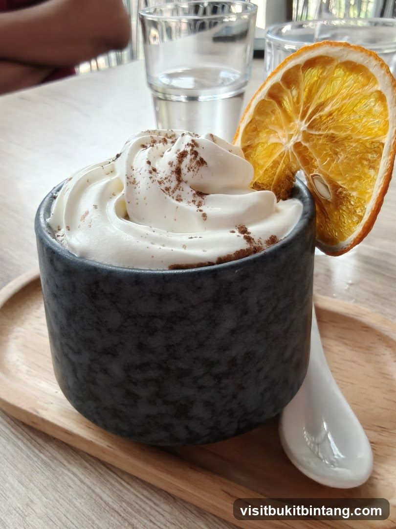 Dessert with Whipped Cream and Orange Slice