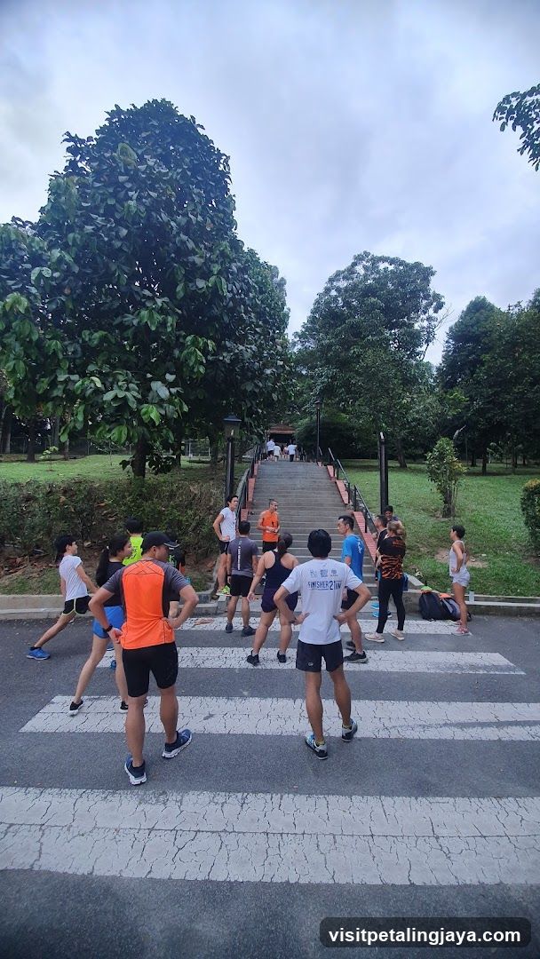 Group of runners at a park entrance
