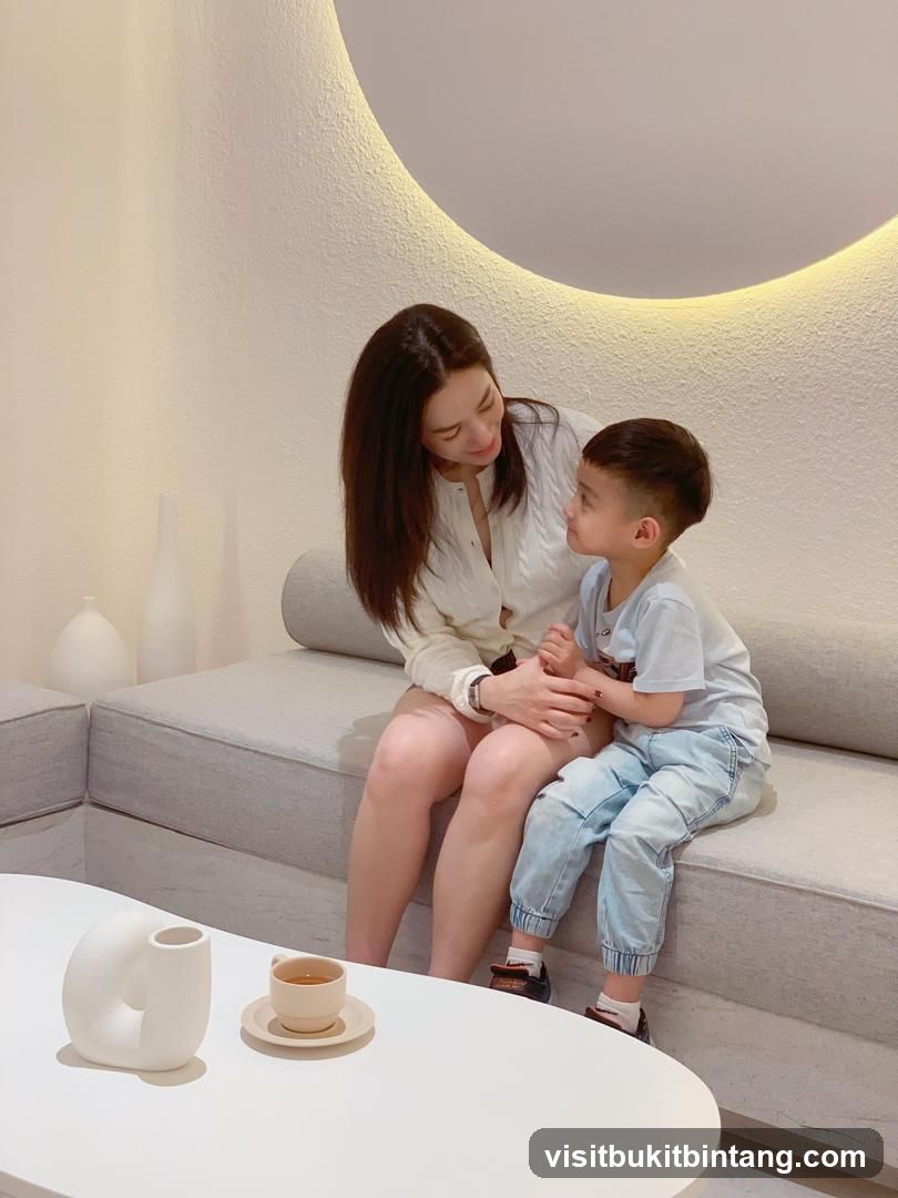Mother and son sitting on a couch