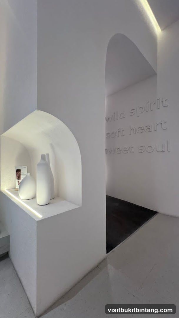 Interior with decorative vases and text on wall