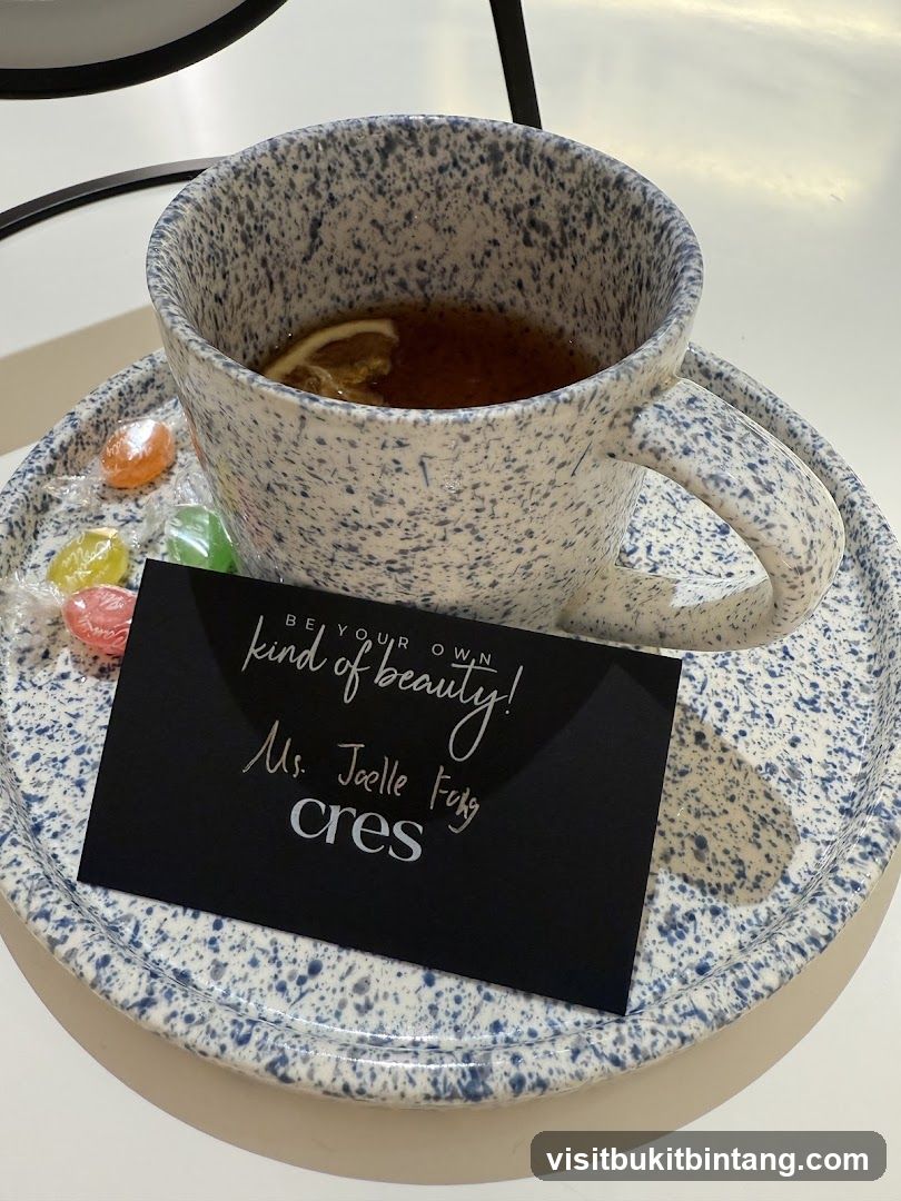 Tea with a business card and candies
