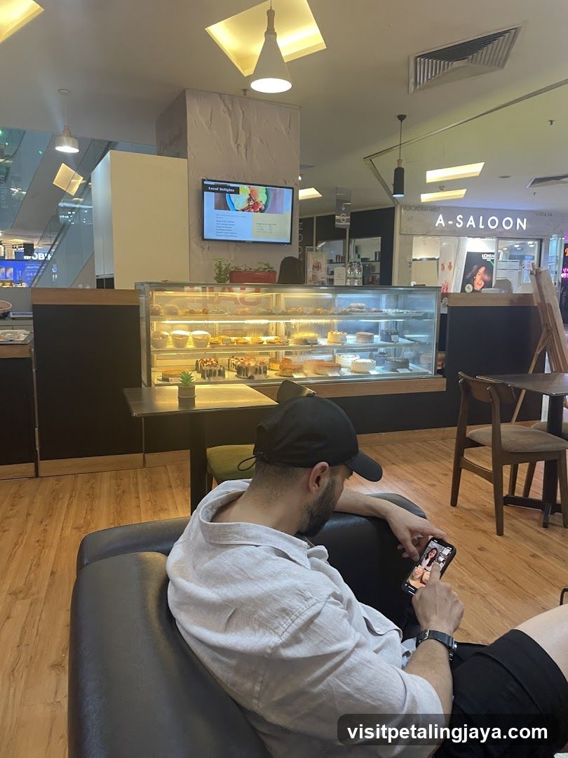 Interior of a cafe or bakery with a customer on phone