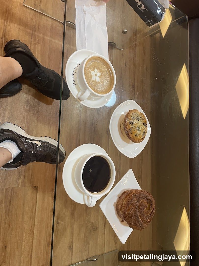Coffee and Pastries on Glass Table