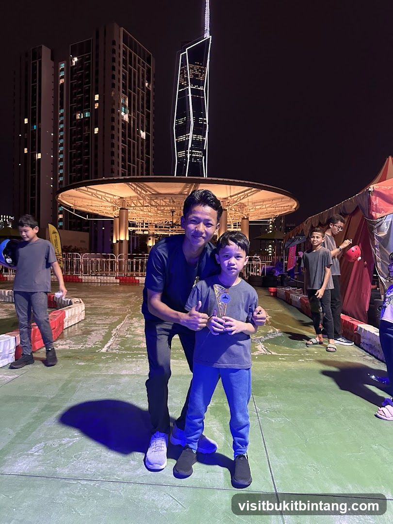 Two boys posing for a photo at night