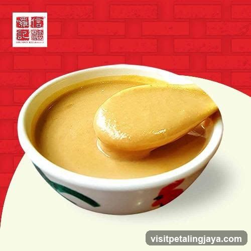 Bowl of Peanut Sauce with Spoon