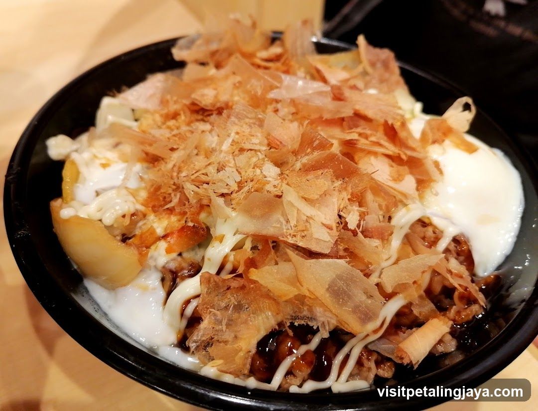Bowl of Japanese Rice Dish with Toppings