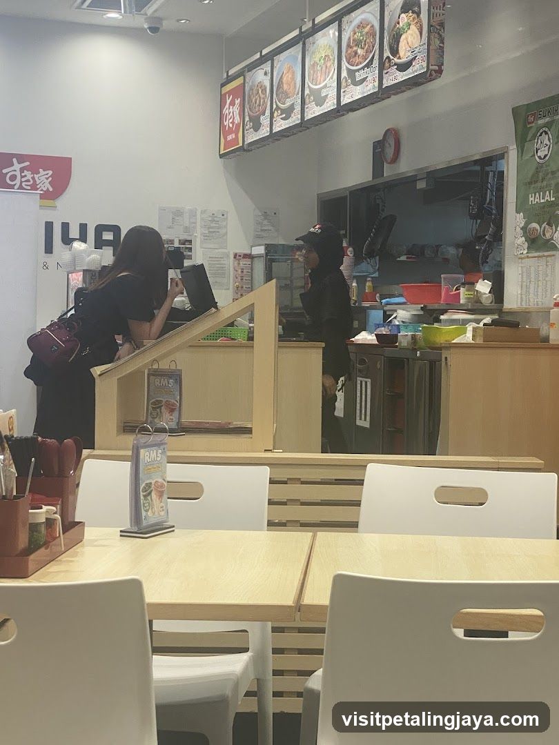 Restaurant Interior with Counter and Staff