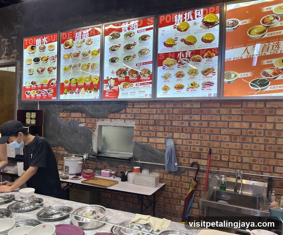 Dining Area with Menu Boards and Staff