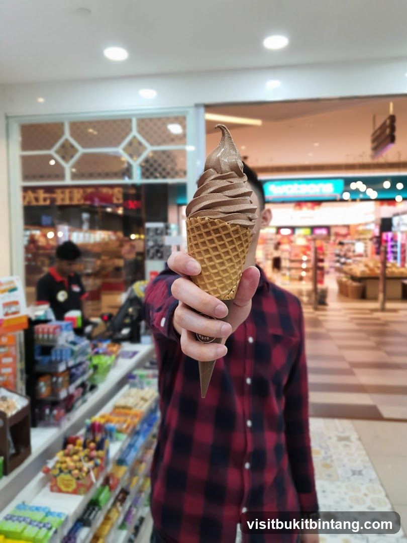 Person holding an ice cream cone