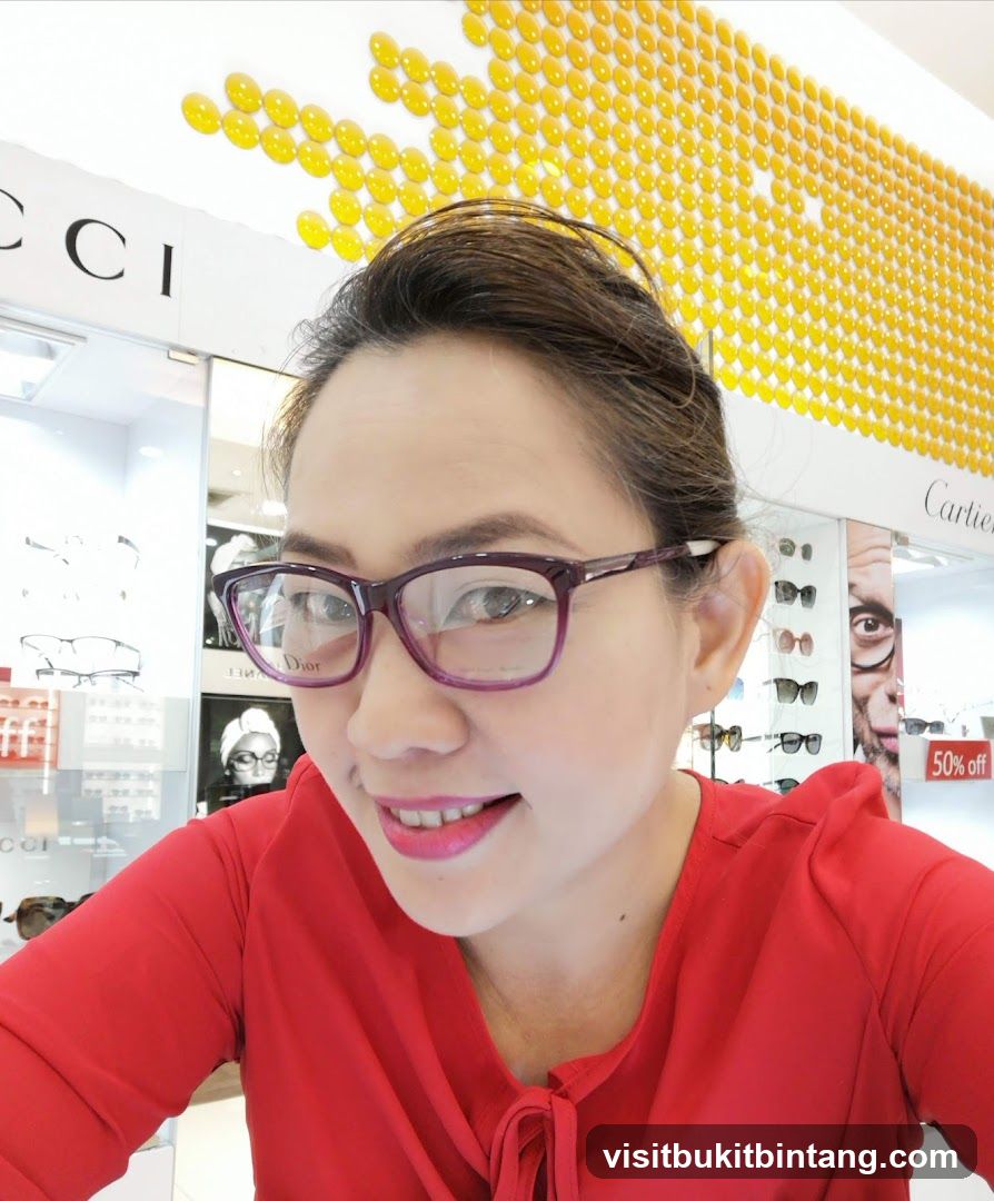 Woman wearing glasses in optical store