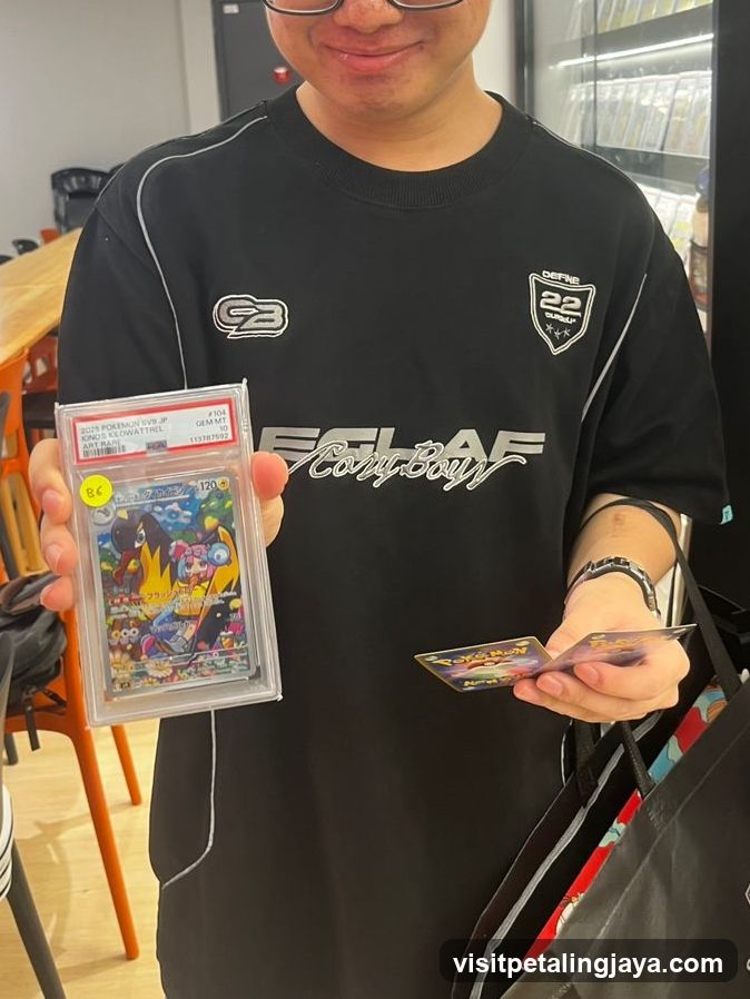 Person holding Pokémon cards in store