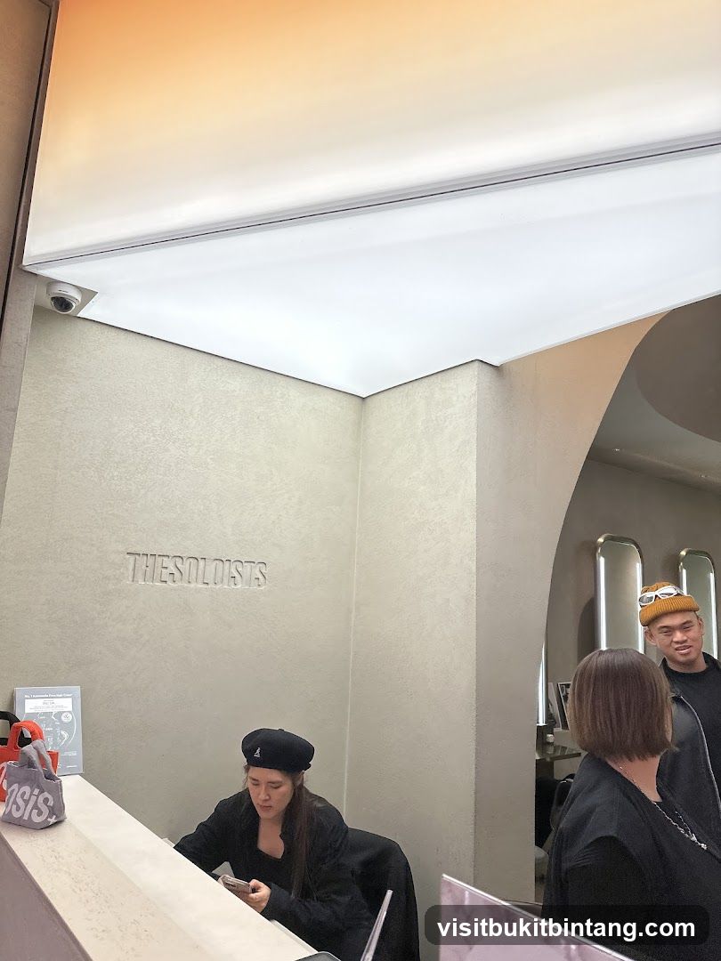 Interior of a store with staff and customers