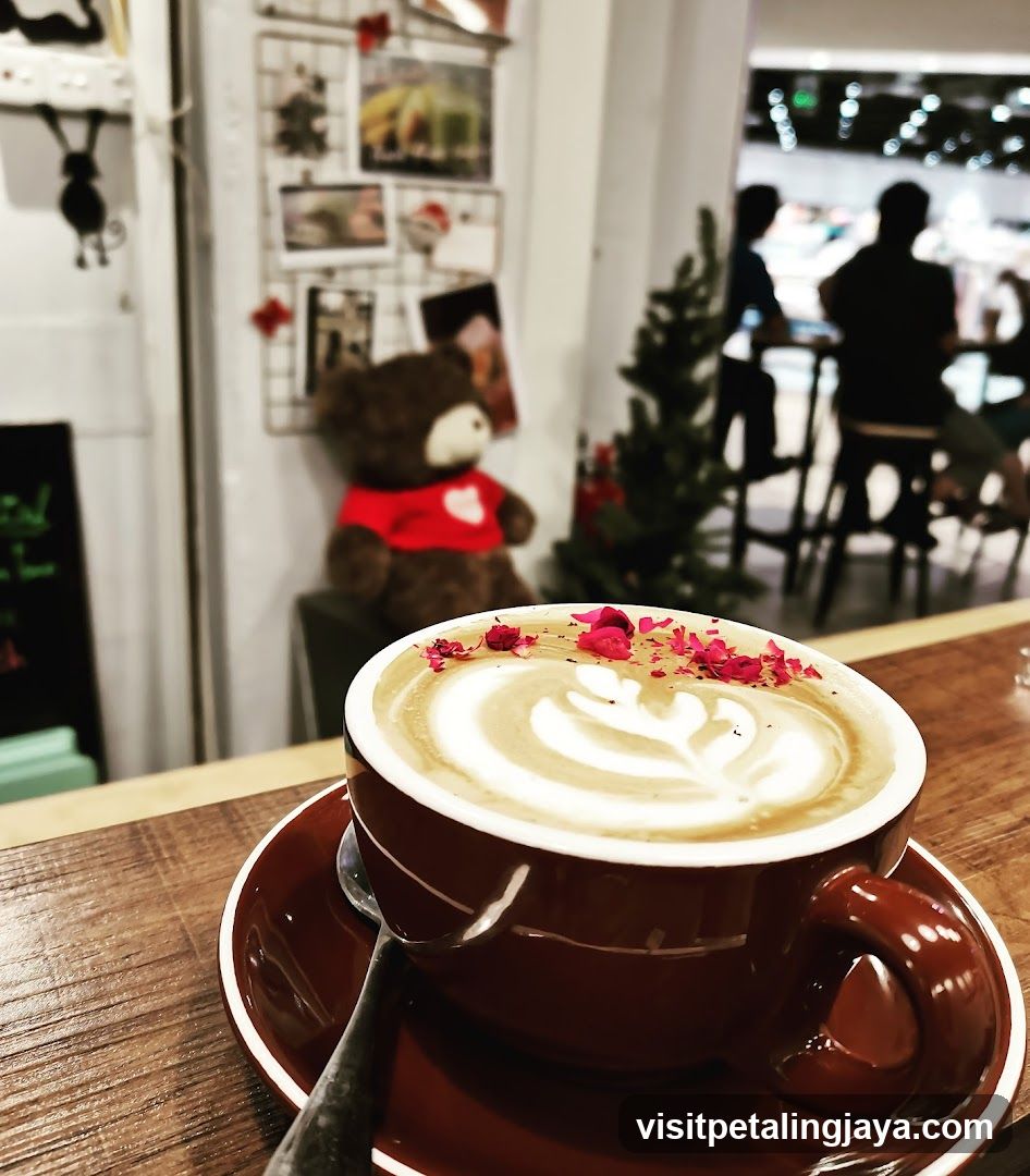 Latte with Rose Petals in Cafe Interior
