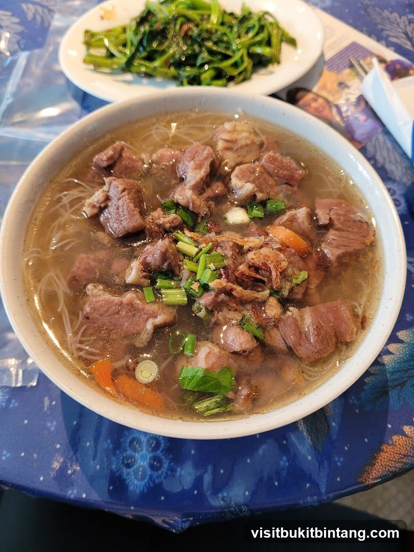 Beef noodle soup with greens