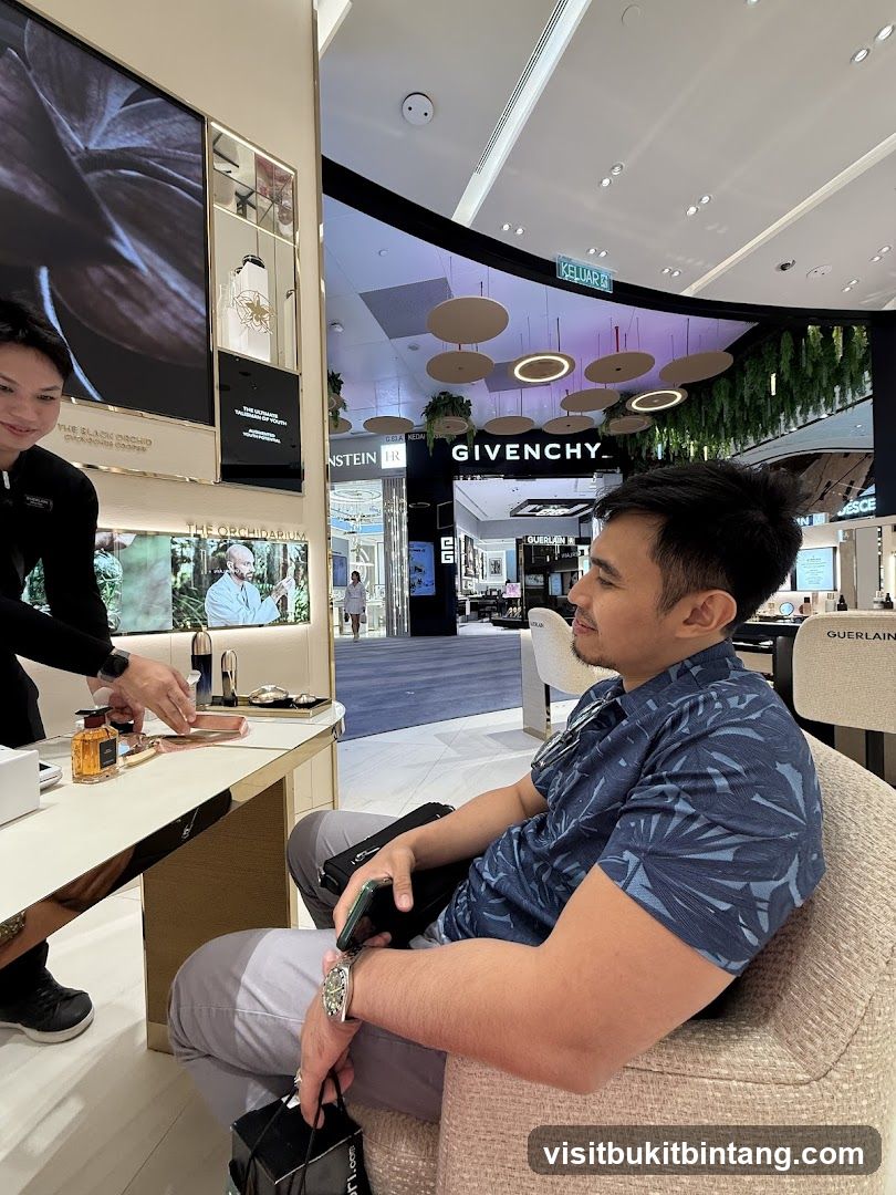 Man sitting in a store looking at products