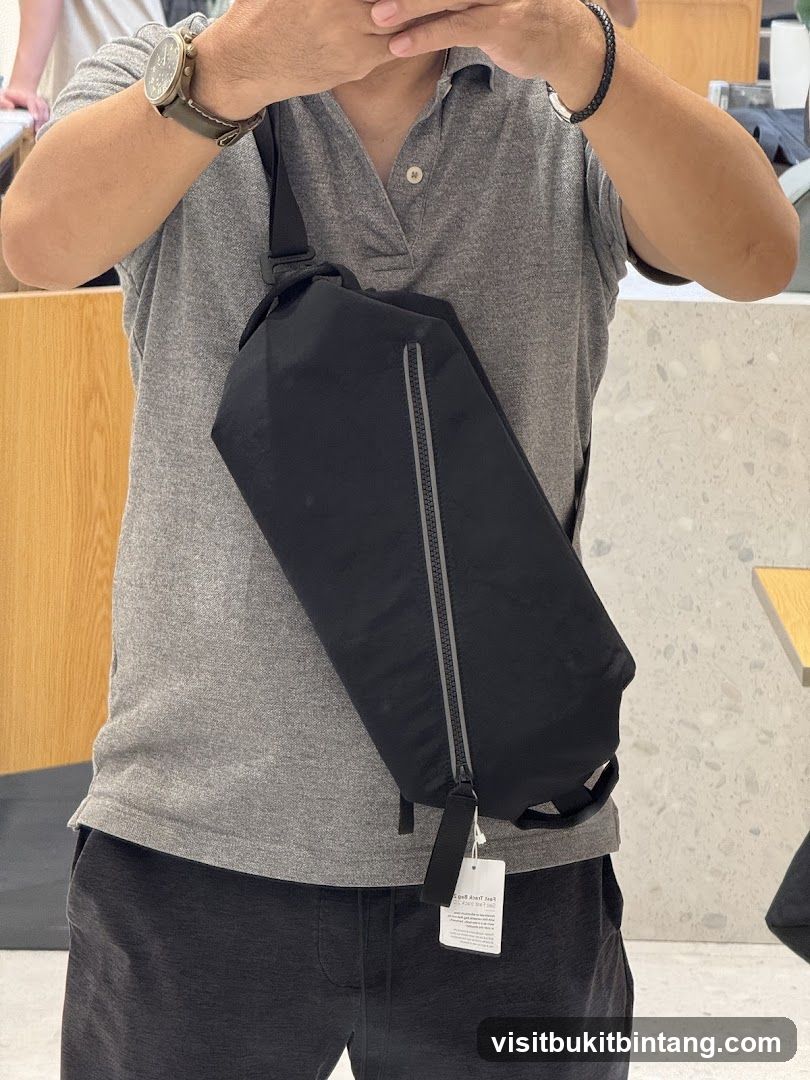 Man wearing a black sling bag