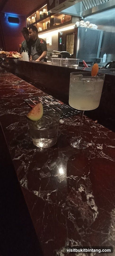Bar Counter with Drinks and Staff