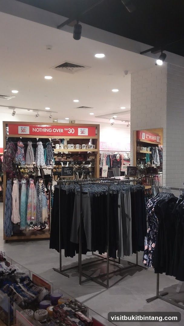 Clothing store interior with sale signs
