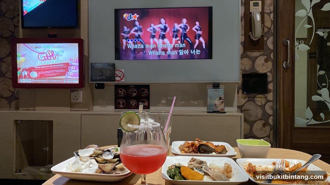 Karaoke room with food and drinks