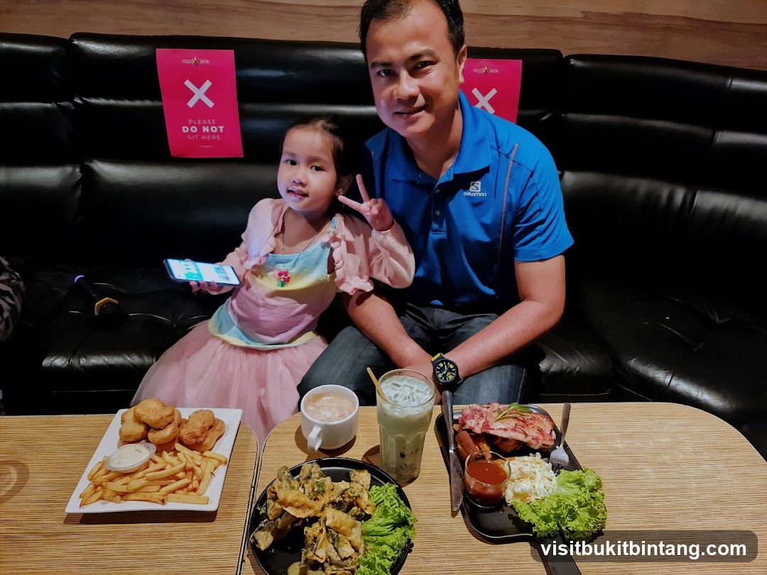 Father and Daughter Enjoying Food
