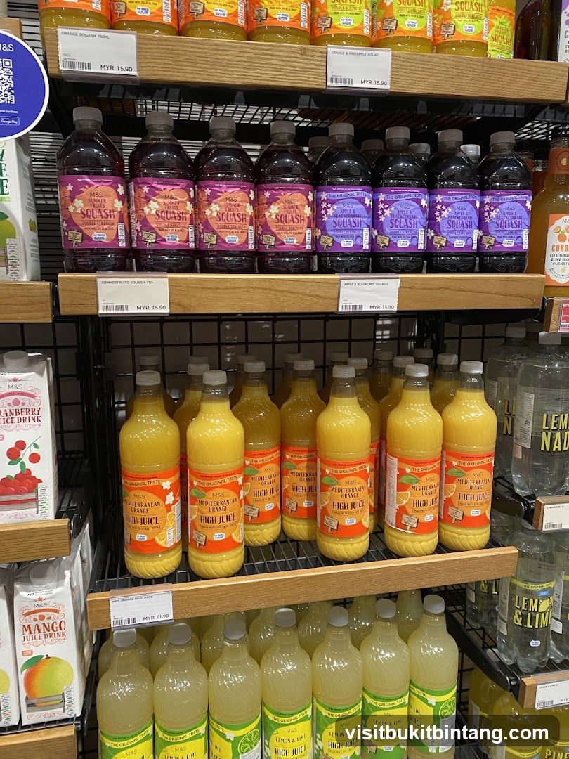 Bottles of juice and squash on shelves