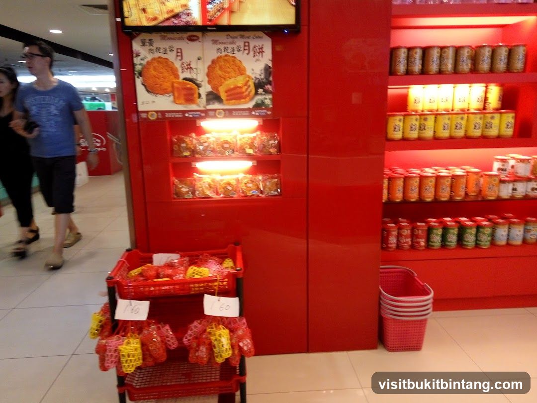 Red Display Shelves with Canned Goods and Mooncakes