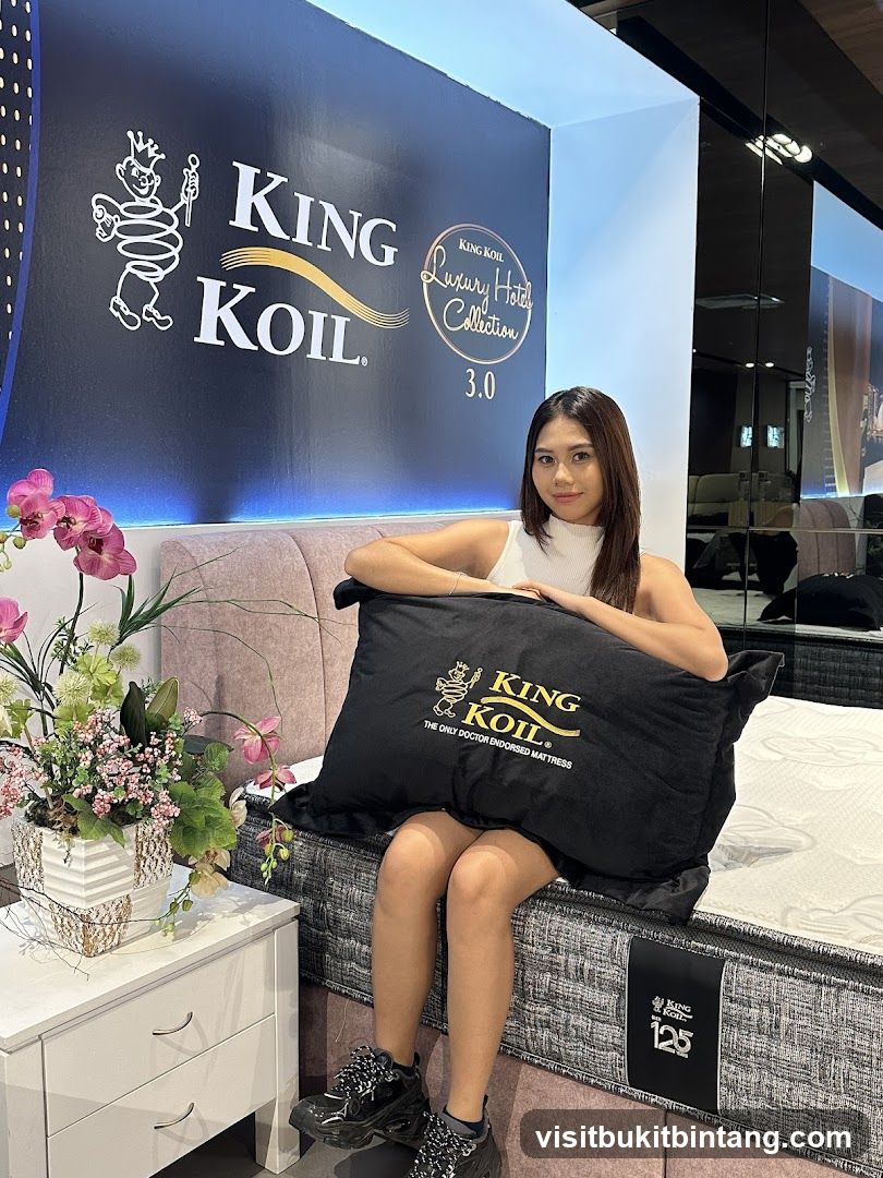 Woman Posing with King Koil Mattress and Pillow