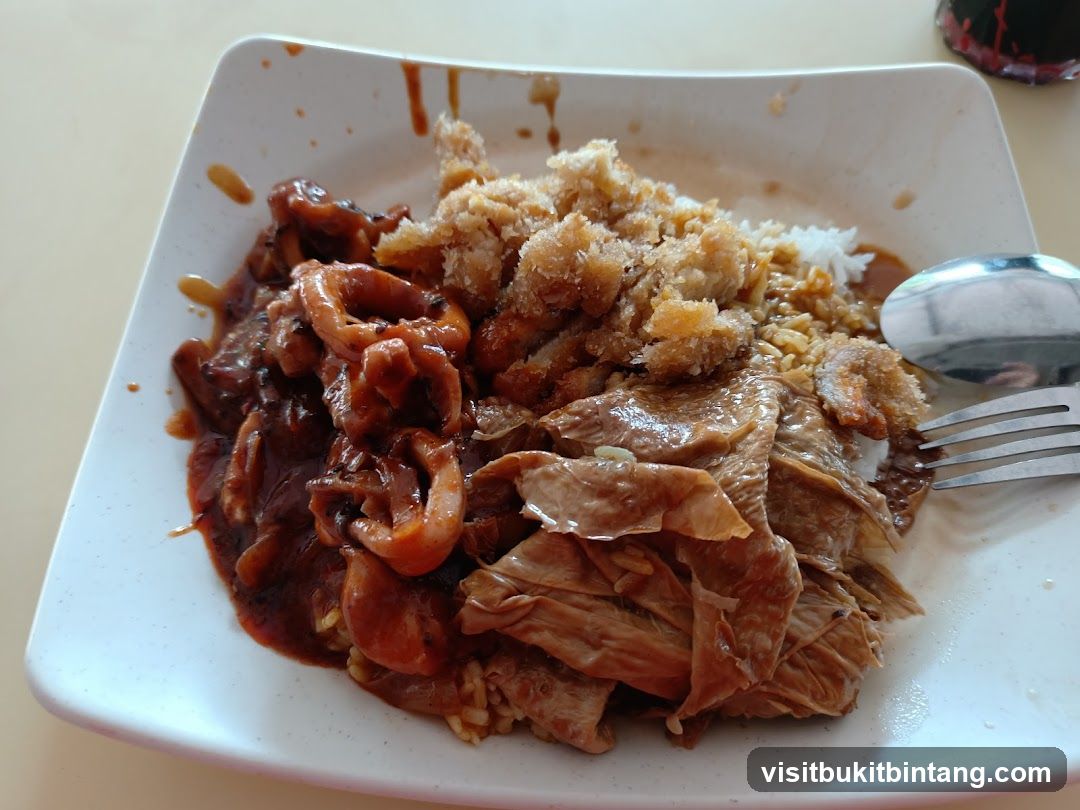 Plate of food with rice and various toppings