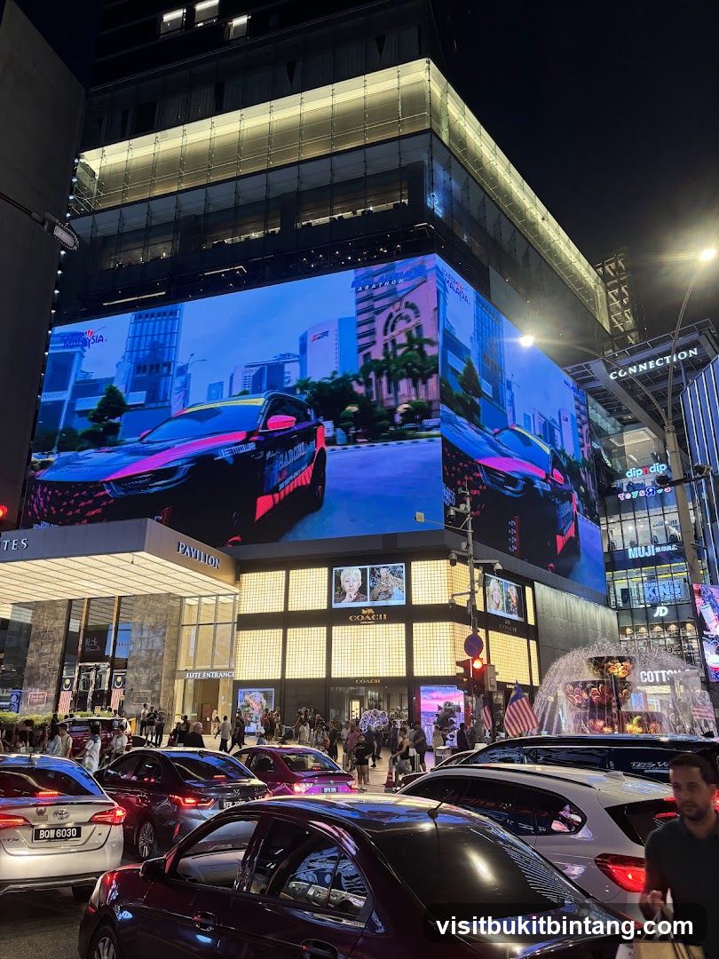 Busy City Street at Night with Large Digital Billboard