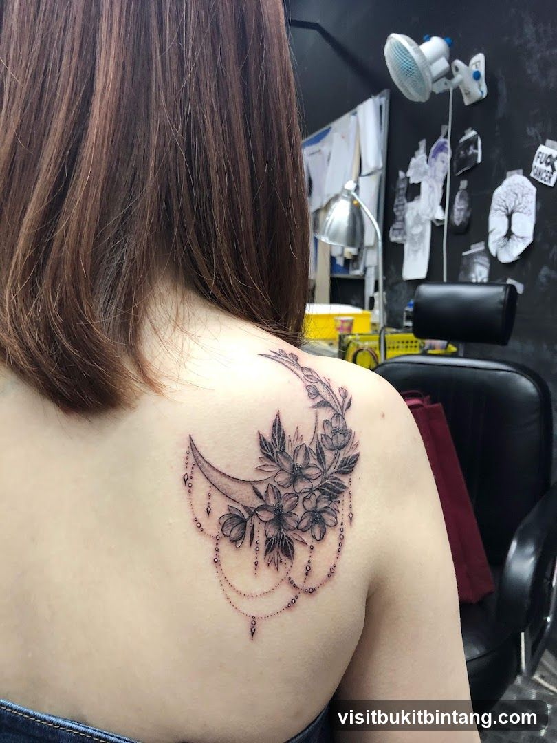 Tattoo of a Crescent Moon with Flowers