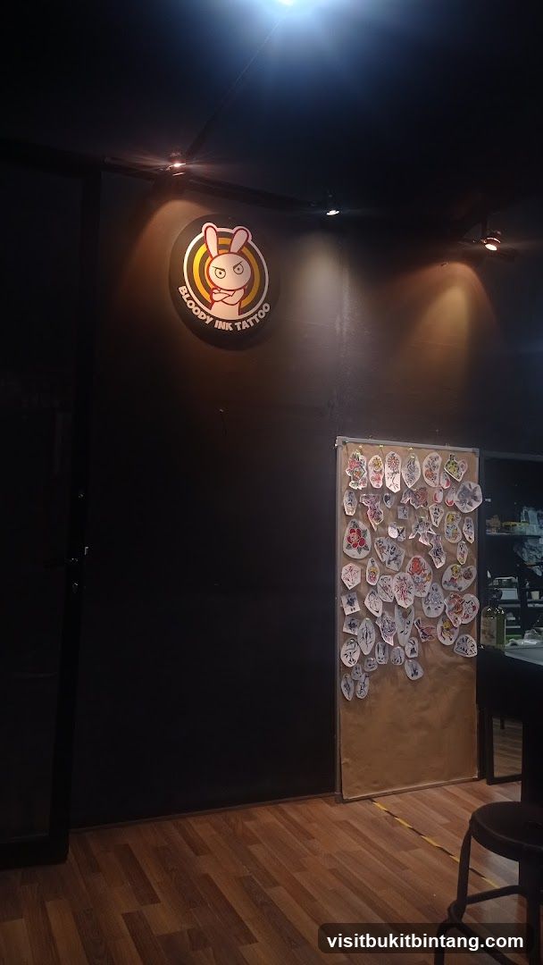 Tattoo shop interior with logo and flash art