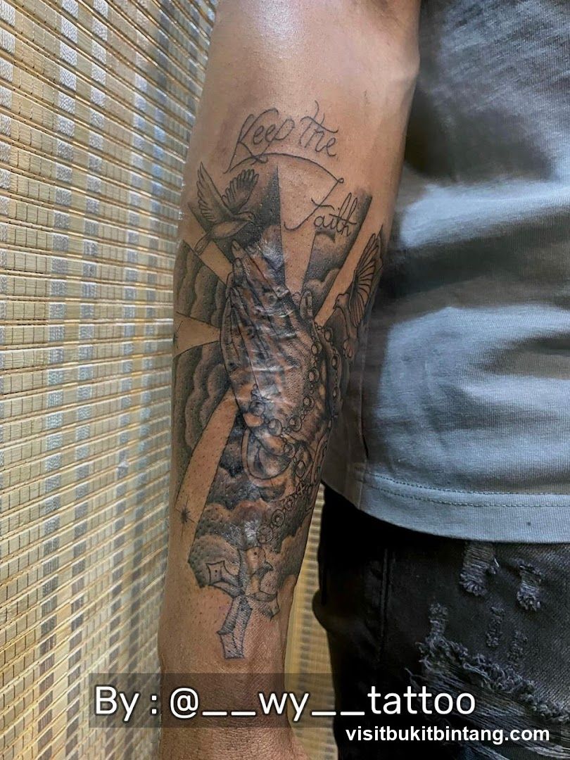 Tattoo of Praying Hands with Doves and Cross