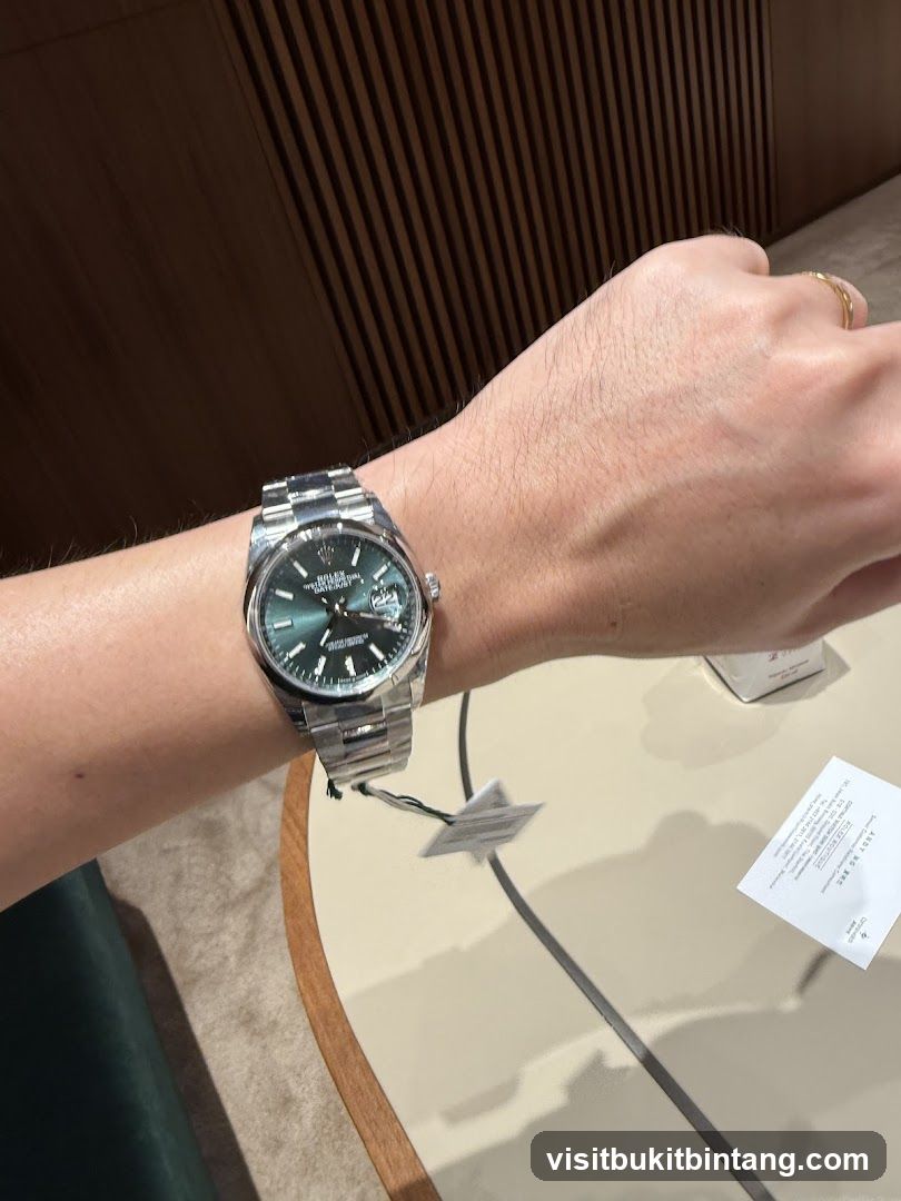 Person wearing a Rolex watch