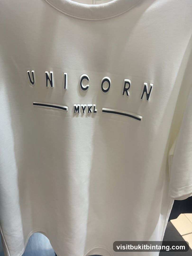 White T-shirt with "UNICORN MYKL" text