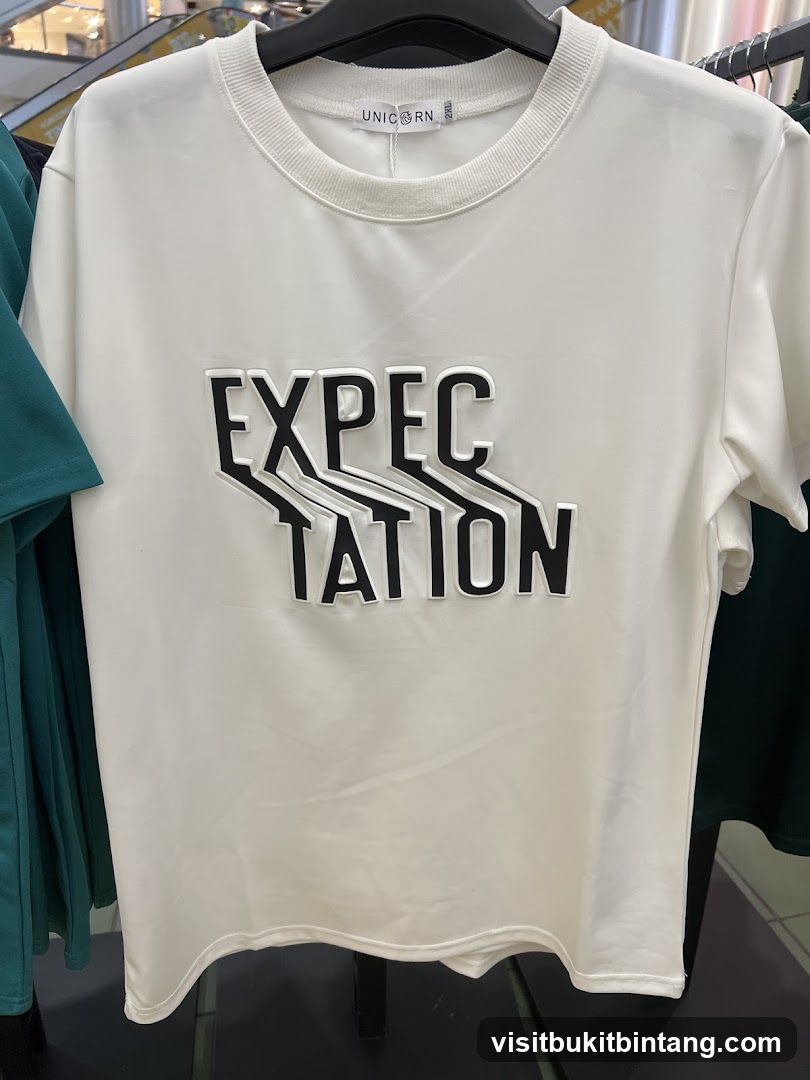 White T-shirt with "EXPECTATION" graphic