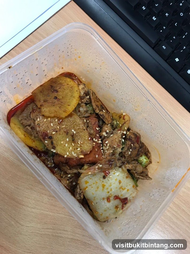 Spicy Stir-Fried Dish in Takeout Container