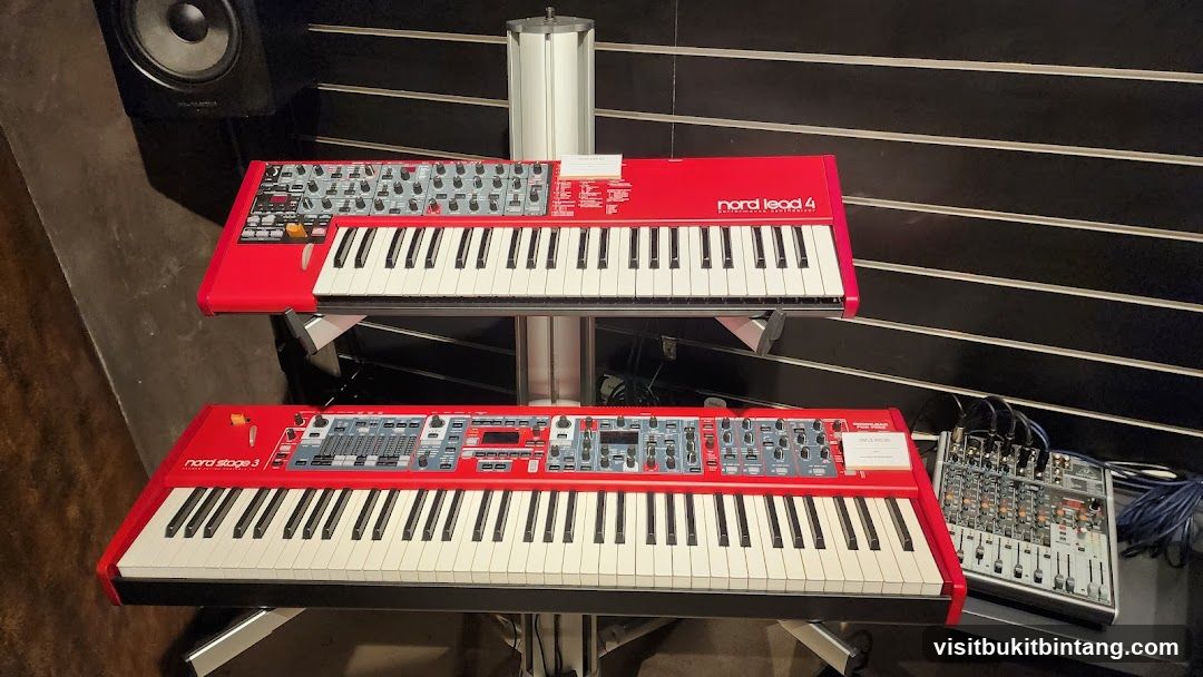 Two red synthesizers on display