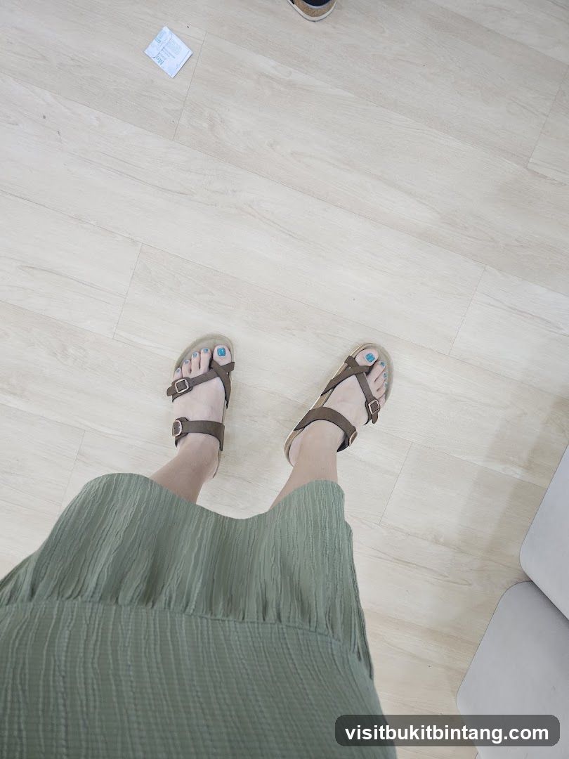 Feet in Sandals and Green Dress