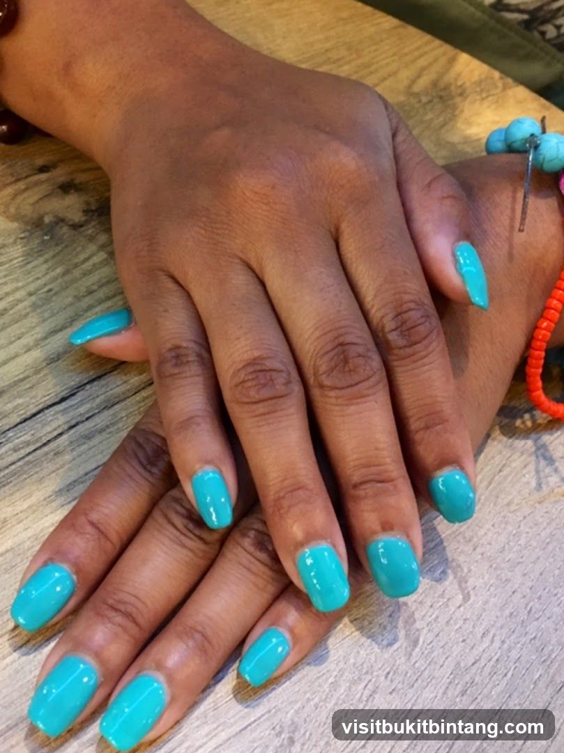 Hands with Teal Nail Polish