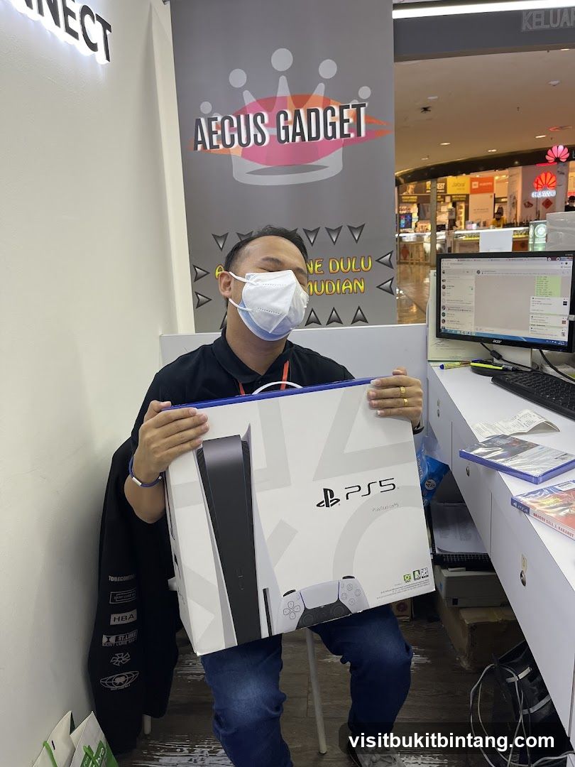 Man holding a PlayStation 5 box
