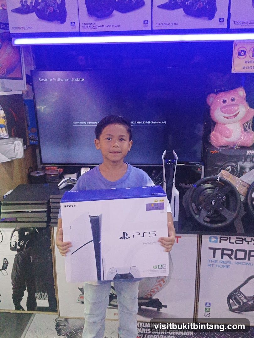 Boy holding a PlayStation 5 box
