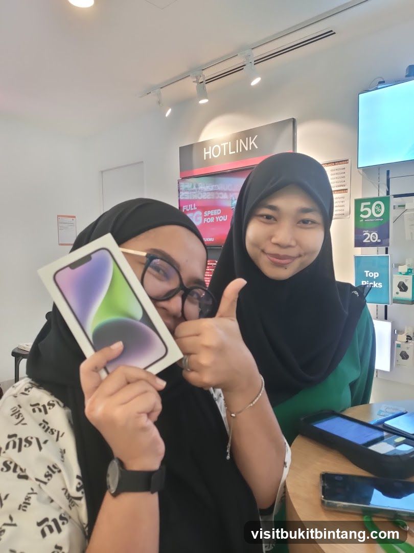 Two women with a new phone