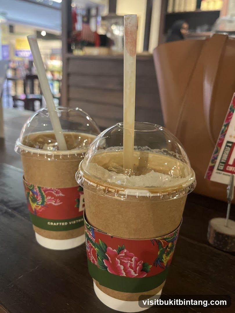 Two iced coffees with straws