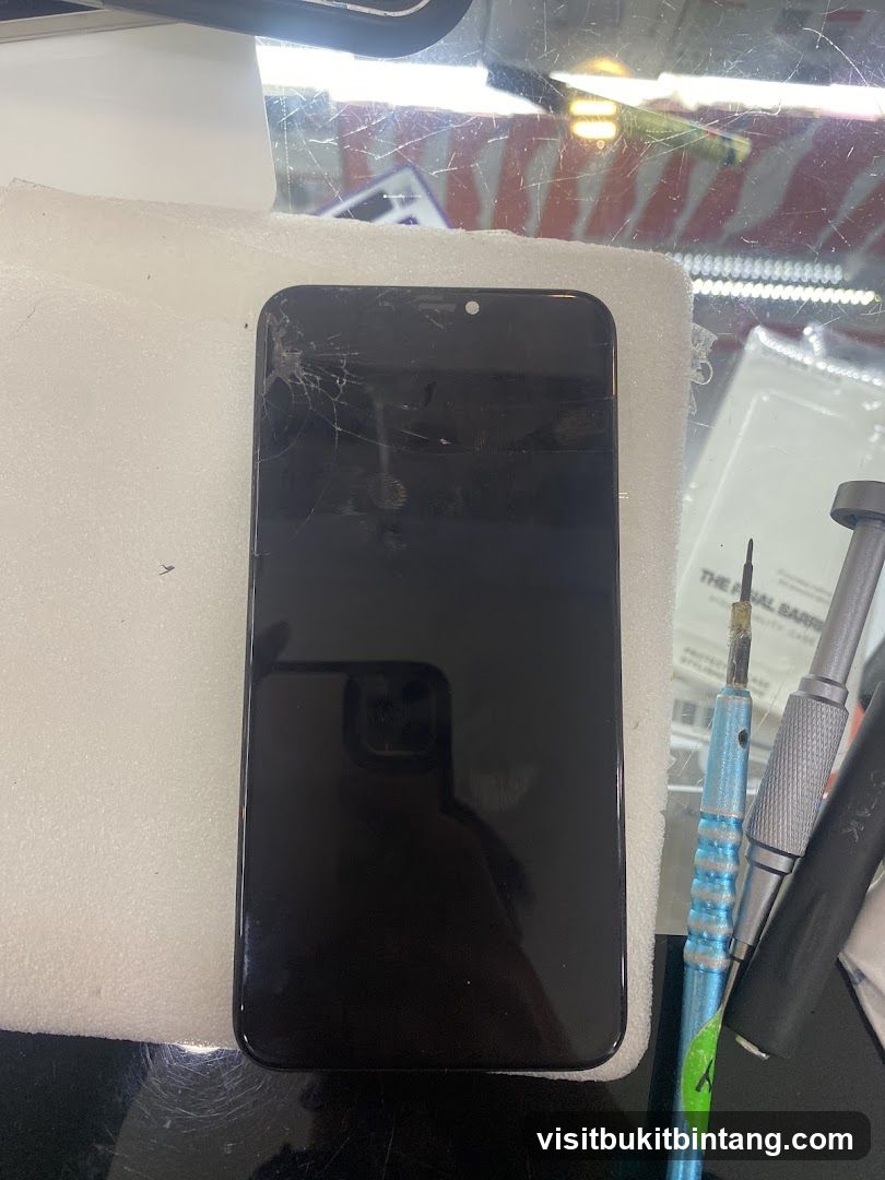 Cracked Phone Screen and Repair Tools