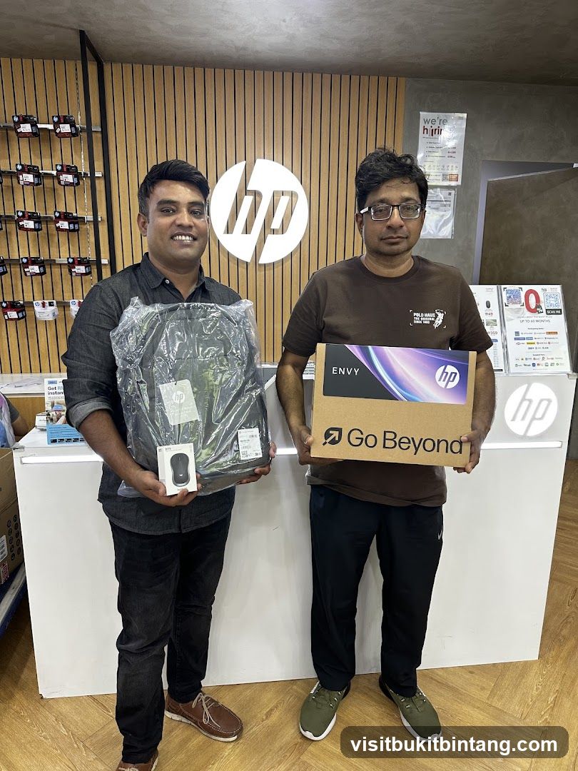 Two men holding HP products
