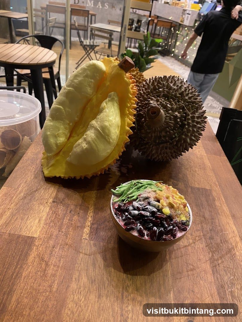 Durian and dessert on a wooden table