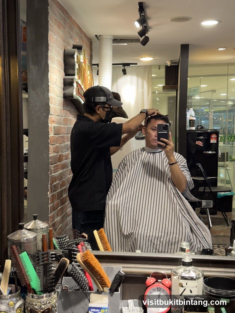 Barber cutting hair