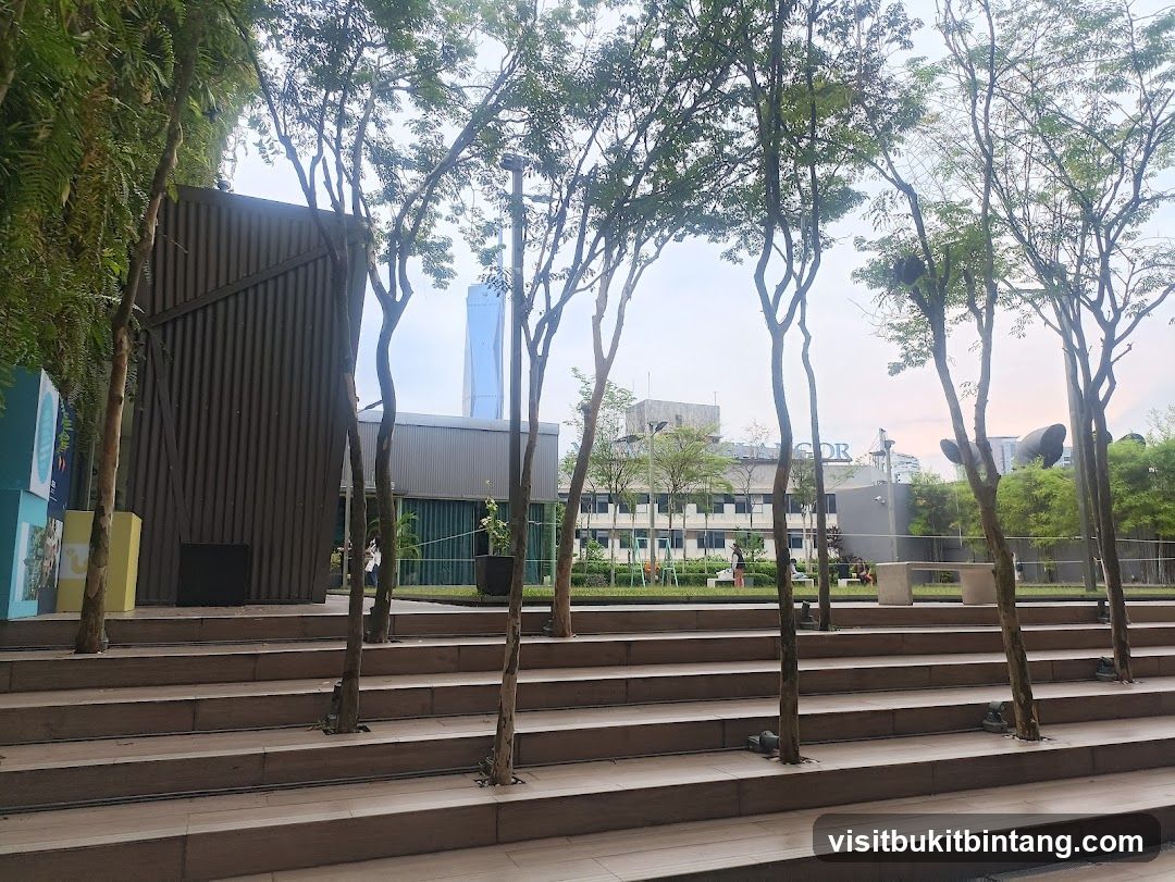 Outdoor seating area with trees and buildings