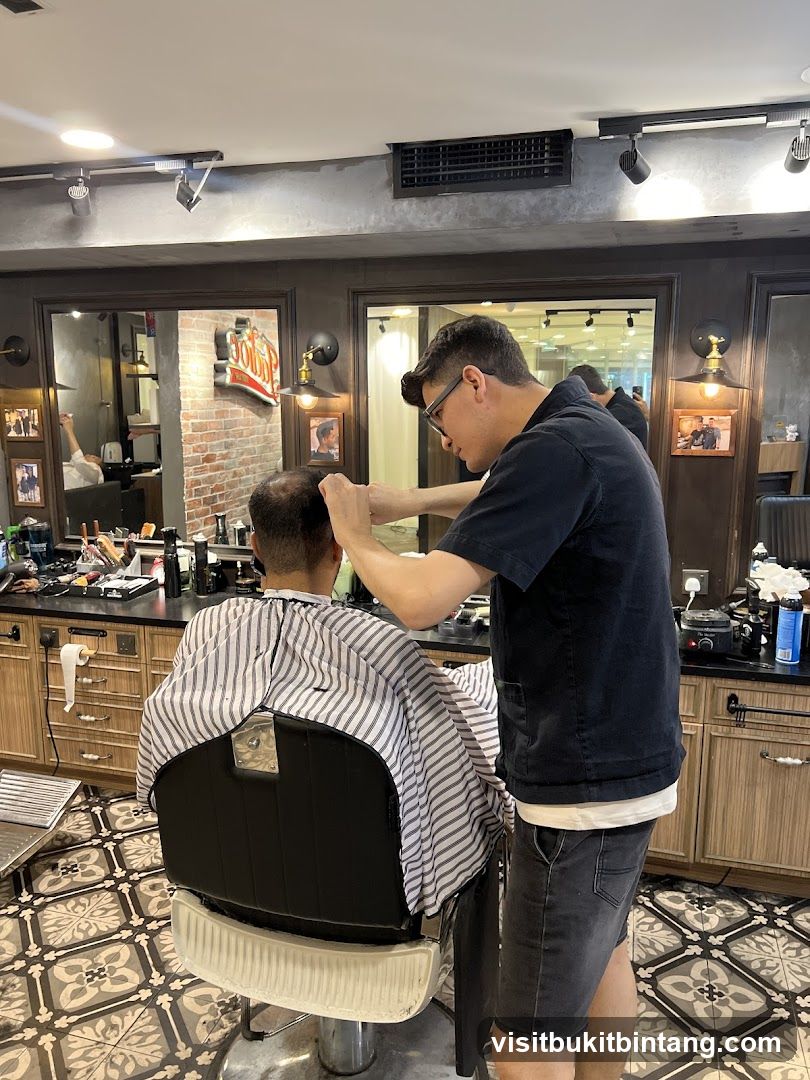 Barber cutting client's hair